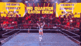 a woman in a wrestling ring with a sign that says no quarter catch crew behind her