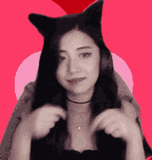 a woman wearing cat ears and a choker necklace