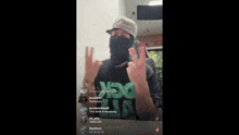 a man wearing a mask and a shirt that says nsg