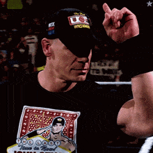 a man wearing a black shirt with the name john cena on it