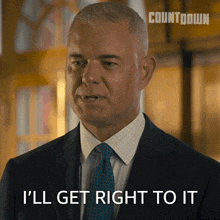 a man in a suit and tie is saying " i 'll get right to it "