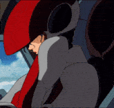 a cartoon character wearing a red helmet is sitting in a car