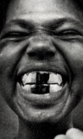 a close up of a person 's mouth with a smiley face on it