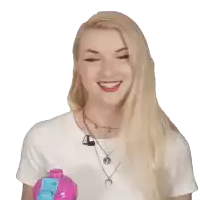 a blonde woman wearing a white shirt and a necklace with a crescent moon pendant