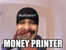 a man wearing a hat that says multivers on it is holding money