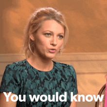 a woman says " you would know " in front of her face
