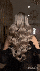 a woman 's hair is shown in a video taken by inshot