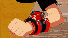 a cartoon character wearing a red and black watch on his wrist .