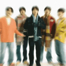 a blurry picture of a group of people standing in a line