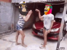 two people dancing in front of a red car with the hashtag #layc on the bottom