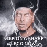 a man is standing in front of a lightning bolt and says step on a sharp lego now .