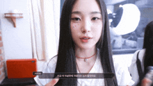 a girl with long black hair talks to jiyeon in korean