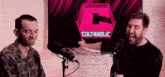 two men are standing in front of microphones with a cultaholic logo behind them