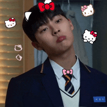 a boy with hello kitty stickers on his face