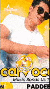 a man wearing sunglasses and a white shirt with a starmaker logo in the corner