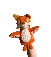 a person is holding a stuffed fox puppet