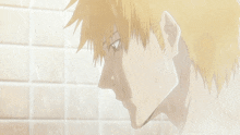 a close up of a man taking a shower