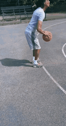 a man is jumping in the air while playing basketball on a court ..