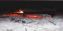 a black and white photo of a fire and ash