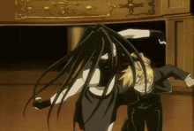 a woman with long black hair is standing next to a man with blonde hair