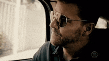 Looking Out Car Window Sunglassess GIF - Looking Out Car Window Sunglassess Seal Team GIFs