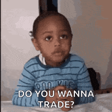 a little boy is laying on a bed and says do you wanna trade ?