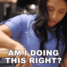 a woman in a blue shirt is being asked if she is doing this right