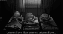 a black and white photo of three children sleeping with the caption unicorns i love