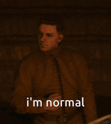 a picture of a man with the words i 'm normal written below him