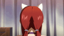 a girl with red hair and cat ears has the letters my on her back