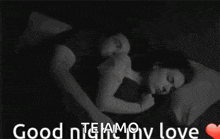 a black and white photo of a man and woman sleeping with the words " good night my love "