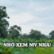 a picture of a field with the words nho xem mv nha on it