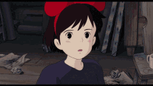 a little girl with a red bow on her head looks surprised