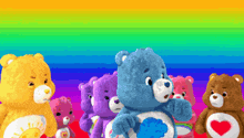 a group of care bears standing next to each other on a rainbow background