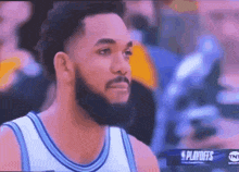 a man with a beard is watching a basketball game on tnt