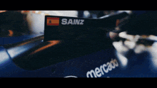 a close up of sainz 's helmet on a race car