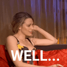 a woman is sitting on a couch with the word well written on the bottom