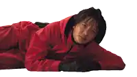a woman in a red outfit is laying on the floor