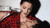 a woman is drinking a bottle of jim beam