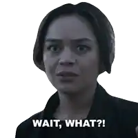 a woman 's face with the words wait what written below it