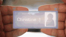 a person is holding a phone with a message that says incoming call christine