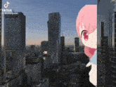 a girl with pink hair is standing in front of a city skyline in a tiktok video