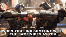 two robots are fighting with a caption that says when you find someone with the same vibes as you