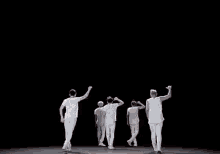a blurred image of the word nuest on a dark background