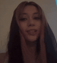 a close up of a woman 's face with a surprised look on her face