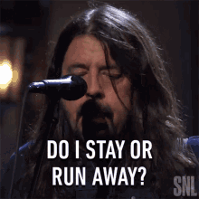 Do I Stay Or Run Away Dave Grohl GIF - Do I Stay Or Run Away Dave Grohl Foo Fighters GIFs
