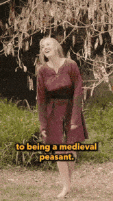 a woman in a red dress is standing in front of a tree with the words " to being a medieval peasant " below her