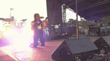 a man on a stage with a shirt that says ' i love you '