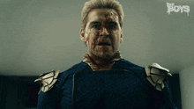 a man with blood on his face and the words the boys on the bottom right