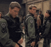 a man in a military uniform has a patch on his sleeve that says ' air force '